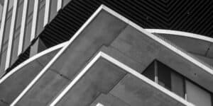 A black and white photo of a modern building.