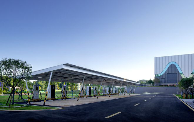 A parking lot with a building in the background.